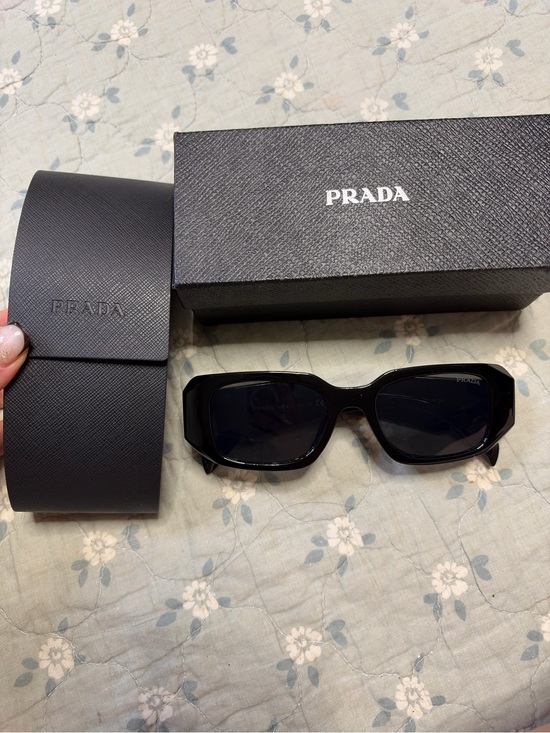 Prada Accessories - Prada women’s Black Sunglasses with Dark Lenses